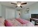 Bedroom features a ceiling fan, closet and neutral color pallette at 11707 Sunburst Marble Rd, Riverview, FL 33579