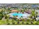 Community pool boasts a uniquely shaped pool, playground, and covered seating area at 11707 Sunburst Marble Rd, Riverview, FL 33579