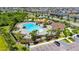Large, resort-style pool area complete with palm trees, plentiful lounge chairs, and nearby playground at 11707 Sunburst Marble Rd, Riverview, FL 33579