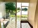 Enclosed lanai with serene water view at 12351 Country White Cir, Tampa, FL 33635