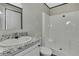 Bathroom with sink, vanity, mirror, and shower at 16137 Melbourne St, Brooksville, FL 34604