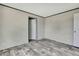 Cozy bedroom showcasing a closet and wood-look flooring at 16137 Melbourne St, Brooksville, FL 34604
