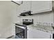 Close up shot of modern kitchen featuring granite countertops, stainless steel appliances, and bright white cabinets at 16137 Melbourne St, Brooksville, FL 34604