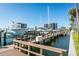 Scenic boat dock showcases boats of various sizes docked near waterfront condos under clear blue sky at 1621 Gulf Blvd # 1604, Clearwater Beach, FL 33767