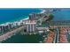 An aerial shot of a condo overlooking the water, showcasing boat docks and nearby amenities at 1621 Gulf Blvd # 1604, Clearwater Beach, FL 33767
