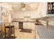 Well lit kitchen with white cabinets, modern appliances, and breakfast bar with views at 1621 Gulf Blvd # 1604, Clearwater Beach, FL 33767