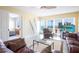 Bright living room features ocean views, modern furniture, and access to the Primary bedroom at 1621 Gulf Blvd # 1604, Clearwater Beach, FL 33767