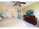 This primary bedroom includes a ceiling fan, ensuite bath, and modern decor at 1621 Gulf Blvd # 1604, Clearwater Beach, FL 33767