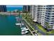 A waterfront property with boat docks, tropical landscaping, and well-maintained grounds at 1621 Gulf Blvd # 1604, Clearwater Beach, FL 33767