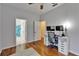 This bedroom includes hardwood floors and an ensuite bathroom with double sinks at 16516 Bridgewalk Dr, Lithia, FL 33547