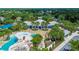 Stunning clubhouse with inviting pool, grotto, and waterslide surrounded by palms and lush landscaping at 16516 Bridgewalk Dr, Lithia, FL 33547