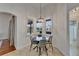 Bright dining area with a modern chandelier and large windows providing ample natural light at 16516 Bridgewalk Dr, Lithia, FL 33547