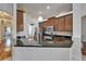 Modern kitchen with granite countertops, stainless steel appliances, and ample cabinet space at 16516 Bridgewalk Dr, Lithia, FL 33547