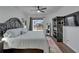 Large main bedroom showcasing a ceiling fan and sliding glass door to the back yard at 16516 Bridgewalk Dr, Lithia, FL 33547