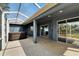 Screened-in patio area with a hot tub and ample outdoor space at 16516 Bridgewalk Dr, Lithia, FL 33547