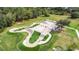 Amazing aerial view of an outdoor skate park with green space, ramps, and landscaped features at 16516 Bridgewalk Dr, Lithia, FL 33547