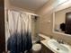 Bathroom featuring a sink and a shower-tub combo with a stylish, nature-themed shower curtain at 1703 N Taylor Rd, Brandon, FL 33510