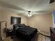 Comfortable bedroom with a ceiling fan and laminate flooring at 1703 N Taylor Rd, Brandon, FL 33510
