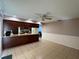 Open dining area with tile floors and a view into the kitchen and connected living space at 1703 N Taylor Rd, Brandon, FL 33510