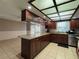 Spacious kitchen with granite countertops, stainless steel appliances, and ample storage at 1703 N Taylor Rd, Brandon, FL 33510