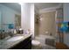 Neutral toned bathroom with granite countertop, vanity, and shower-tub combo at 19047 Alfaro Loop, Spring Hill, FL 34610