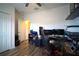 Bright bedroom features a hardwood floor and an open doorway for natural light at 19047 Alfaro Loop, Spring Hill, FL 34610