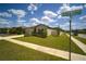 Corner lot featuring a single-story home with a lush lawn and beautifully landscaped yard at 19047 Alfaro Loop, Spring Hill, FL 34610