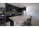 Modern kitchen boasting granite countertops, stainless steel appliances, and ample storage space at 19047 Alfaro Loop, Spring Hill, FL 34610