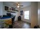 Bright office space with floating shelves, wood-look flooring, and ample workspace at 19047 Alfaro Loop, Spring Hill, FL 34610