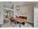 Inviting dining room with a rustic wood table, modern lighting, and natural accents at 1910 Elk Spring Dr, Brandon, FL 33511