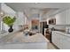 Bright kitchen featuring granite countertops, stainless steel appliances, and white cabinetry at 1910 Elk Spring Dr, Brandon, FL 33511