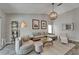 Comfortable living room with ample seating, a round wooden coffee table and decor at 1910 Elk Spring Dr, Brandon, FL 33511