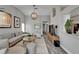 Spacious living room featuring a cozy seating arrangement, wood floors, and contemporary lighting at 1910 Elk Spring Dr, Brandon, FL 33511