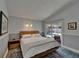 Bright main bedroom with a pool view and sliding glass doors to the backyard at 1910 Elk Spring Dr, Brandon, FL 33511