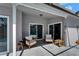 Cozy covered patio with stylish seating, providing a comfortable outdoor space for relaxation and entertainment at 1910 Elk Spring Dr, Brandon, FL 33511