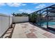 The fenced-in pool offers a secluded retreat for relaxation, complemented by a charming patio area at 1910 Elk Spring Dr, Brandon, FL 33511