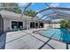 Sparkling screened-in pool with a spacious deck, perfect for outdoor relaxation and entertaining in style at 1910 Elk Spring Dr, Brandon, FL 33511