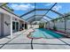 Beautiful screened-in pool area featuring a spacious deck, ideal for enjoying the Florida sunshine and outdoor living at 1910 Elk Spring Dr, Brandon, FL 33511