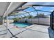 Spacious screened-in pool with a brick trim and deck, perfect for entertaining and relaxation at 1910 Elk Spring Dr, Brandon, FL 33511
