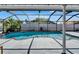 Picturesque screened-in pool offering a refreshing escape, complete with well-maintained landscaping for added privacy at 1910 Elk Spring Dr, Brandon, FL 33511