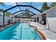 Inviting screened-in pool with a brick trim, complemented by an ample deck space for sunbathing and leisure at 1910 Elk Spring Dr, Brandon, FL 33511