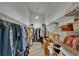 A spacious walk-in closet with an abundance of shelving and hanging storage space for clothing and accessories at 1910 Elk Spring Dr, Brandon, FL 33511