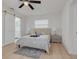 Comfortable bedroom with sliding barn door, creating an elegant private retreat at 1952 Algonquin Dr, Clearwater, FL 33755
