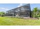 Spacious backyard with a screened-in pool area at 19837 Lonesome Pine Dr, Land O Lakes, FL 34638