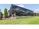 Spacious backyard with a screened-in pool area at 19837 Lonesome Pine Dr, Land O Lakes, FL 34638