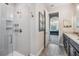Modern bathroom featuring a tiled shower and double sink vanity at 19837 Lonesome Pine Dr, Land O Lakes, FL 34638