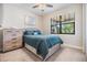 Comfortable bedroom with natural light, carpeted floors, and a large window at 19837 Lonesome Pine Dr, Land O Lakes, FL 34638