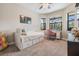 Cozy bedroom with ceiling fan and a sunny window and natural light at 19837 Lonesome Pine Dr, Land O Lakes, FL 34638