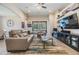 Bright and airy living room featuring tile floors, modern furniture, and a view of the pool area at 19837 Lonesome Pine Dr, Land O Lakes, FL 34638