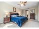 Comfortable main bedroom includes carpeted floors, side tables, and a ceiling fan at 19837 Lonesome Pine Dr, Land O Lakes, FL 34638